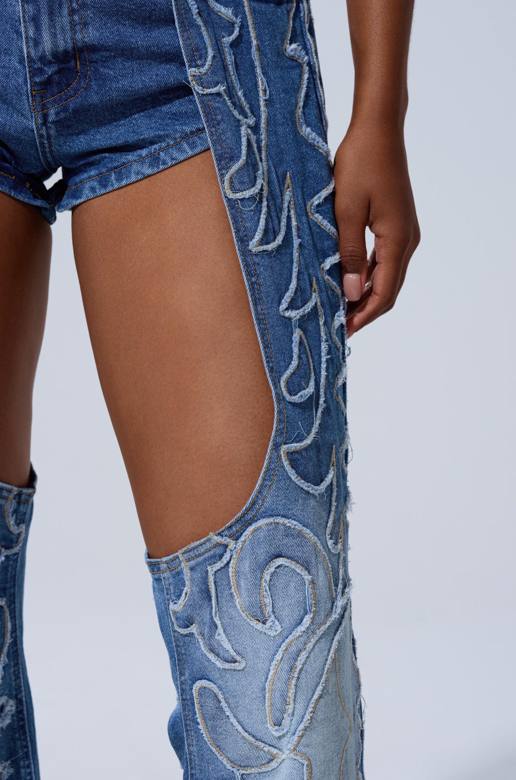 THROW DOWN DENIM JUMPSUIT WITH CHAPS